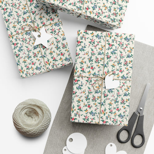Sheet of beige wrapping paper printed with a fine scattered pattern of small wildflowers and stems.